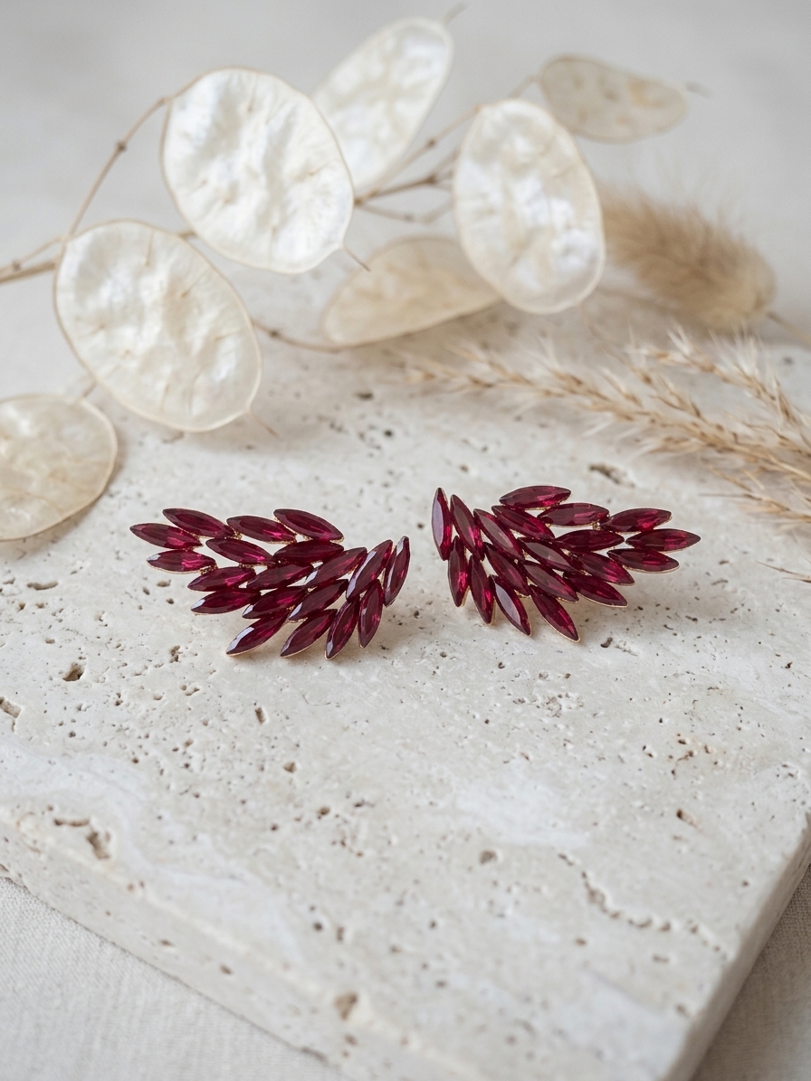 pendientes de ala con cristales rojos